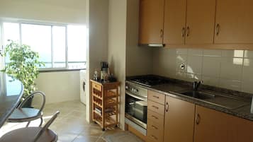 Apartment, Balcony, Sea View | Private kitchen | Espresso maker, coffee/tea maker, electric kettle, toaster