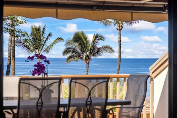 A stunning oceanfront view framed by swaying palm trees, inviting you to unwind in paradise. The perfect spot for a peaceful morning coffee or an evening spent soaking in the sunset.
