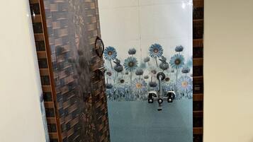 Shower, rainfall showerhead, towels, soap
