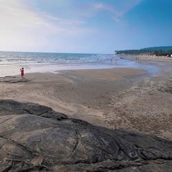 On the beach, white sand, beach towels, beach bar