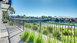 A balcony with a view of a water feature and greenery. - 4-13 Central Dr Victor Harbor - Wi-Fi and Linen (Victor Harbor)