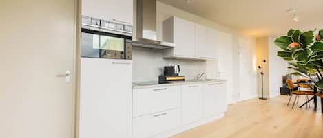 Apartamento | Sala de estar | TV de tela plana 25 polegadas com canais a cabo