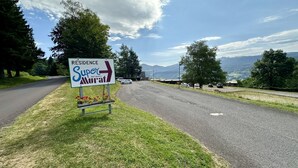 A road sign indicating a residence named 'Super Murat' with an altitude of 1200m.