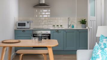 Microwave, oven, dishwasher, dining tables