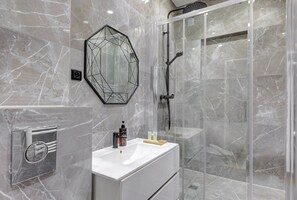 Shower, hair dryer, towels, soap