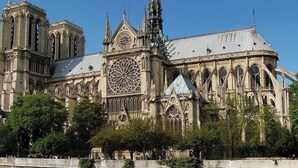 A large cathedral with Gothic architecture, including pointed arches and a large rose window.
