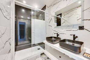 Shower, hair dryer, towels, soap