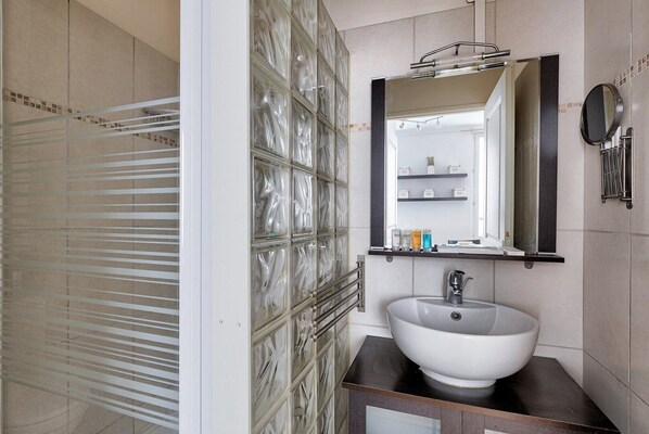 Shower, hair dryer, towels, soap