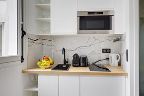 Fridge, microwave, coffee/tea maker, toaster