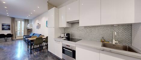 Microwave, oven, toaster, dining tables