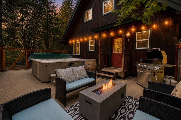 Fenced in back patio space includes propane grill and propane firepit along with your own private hot tub under the stars. Keep Fido safe in this full enclosed patio space. (4)