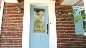 A blue door with a glass panel, white trim, and a wooden ceiling above. - Purdue Bell Tower views, Central WL location, Walk 2 Purdue (West Lafayette)