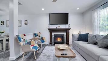 TV, fireplace, books, offices