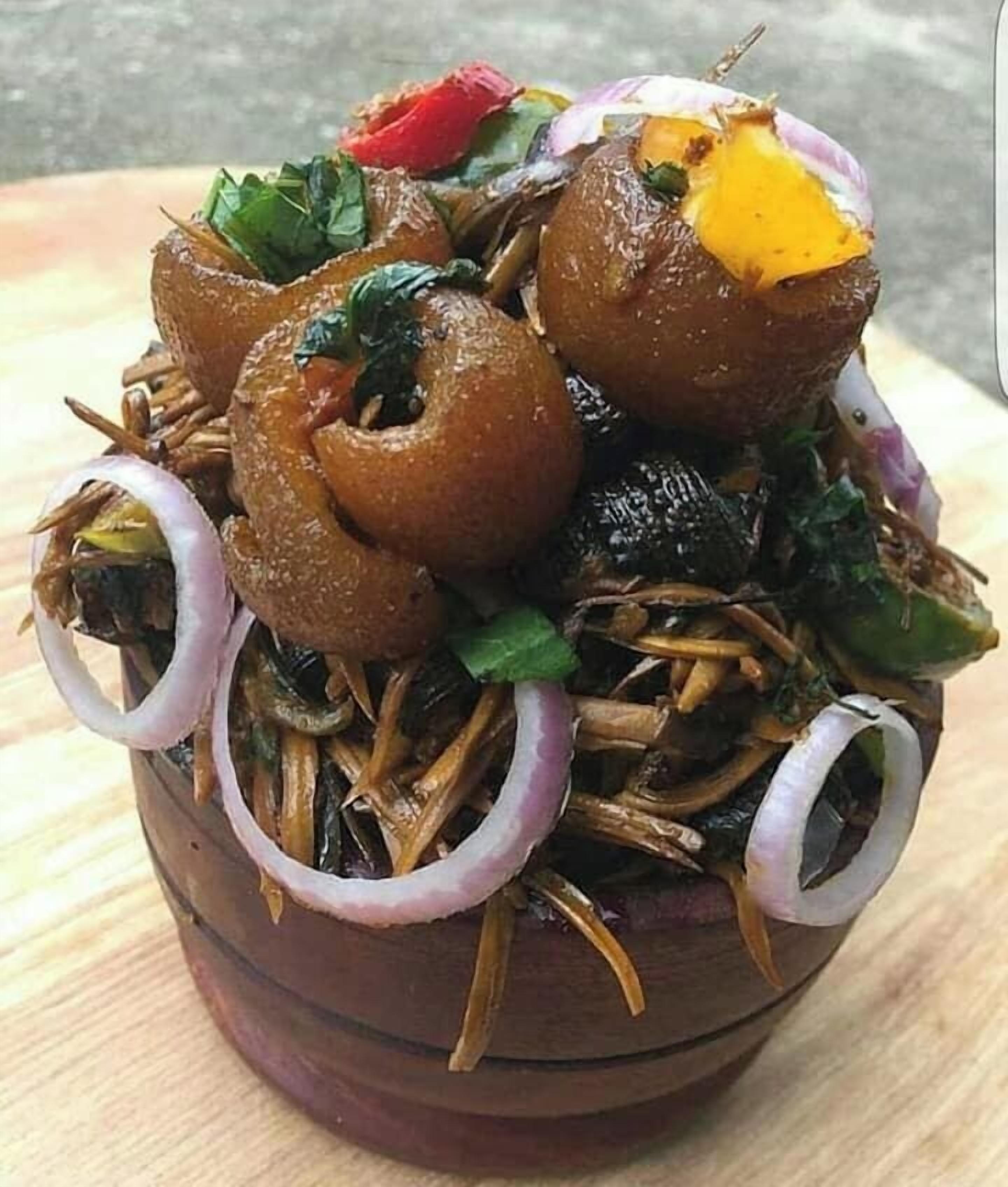 A bowl of food with various ingredients.