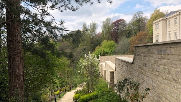 A pathway leading to a building with stone walls and a garden with various plants. - Boutique private apartment convenient for city - Pass the Keys (Bath)