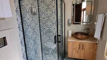 Shower, hair dryer, slippers, towels