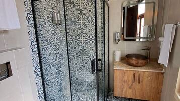 Shower, hair dryer, slippers, towels