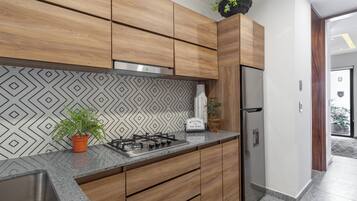 Fridge, microwave, stovetop, coffee/tea maker