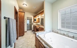 Shower, jetted bath, towels, soap