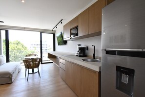 Deluxe Studio, Balcony | Private kitchen - Kumaru Suites by The Spot Rentals (Playa del Carmen)