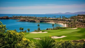 A coastal golf course with a view of the ocean and distant mountains. - Cozy Oceanfront Resort Golf&SPA Suite Pacific Dunes San Lucas 4 p- 1 B./ 2 Bath (cabo san Lucas)