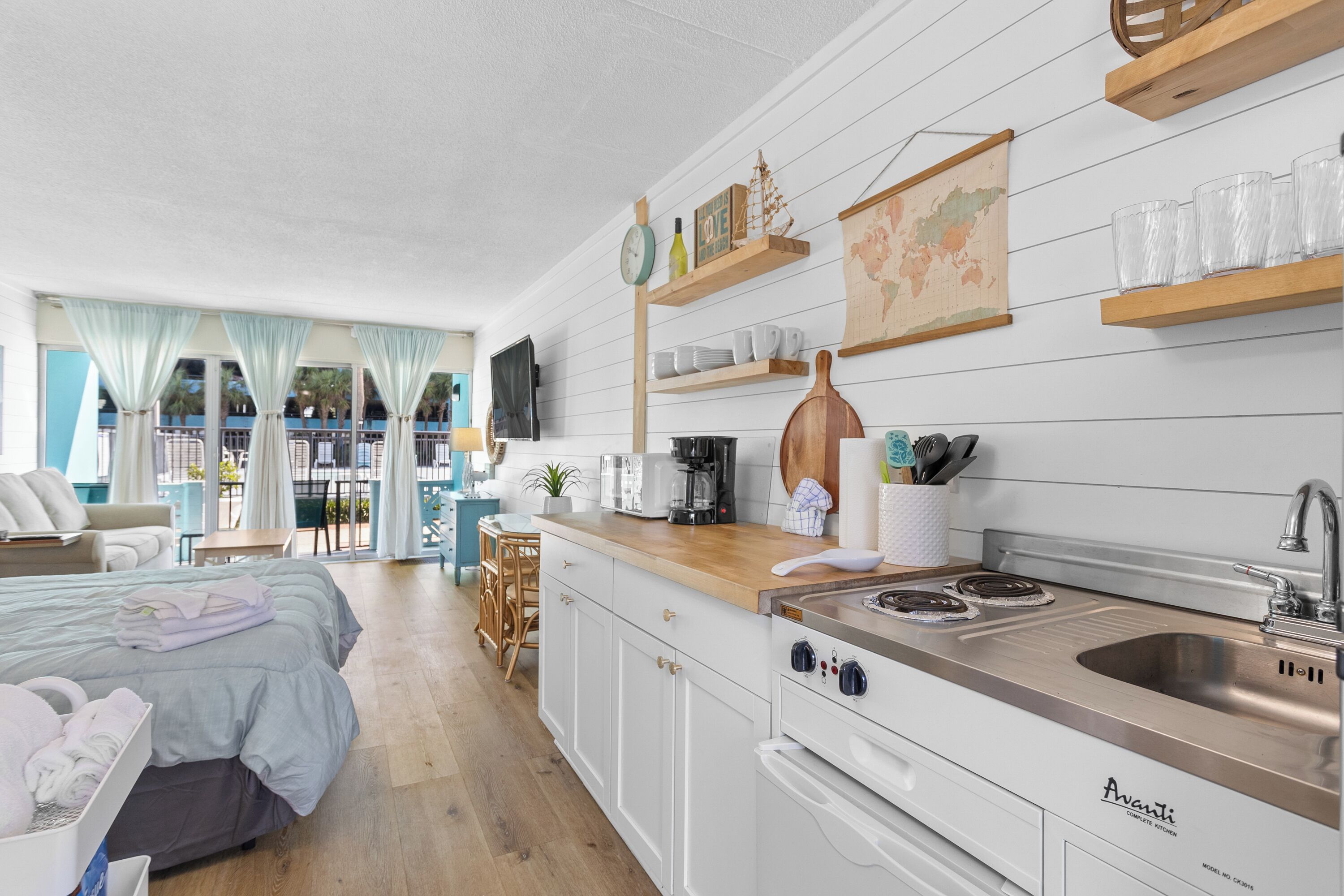 Fridge, microwave, stovetop, coffee/tea maker