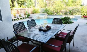 A patio with a pool table, chairs, and a small table with drinks and snacks. - Upscale 6 Bed, 5 Ba, New Pool W/jacuzzi, 1/2 Mile Walk to Disney (Anaheim)