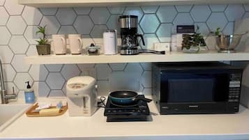 Fridge, microwave, stovetop, coffee/tea maker