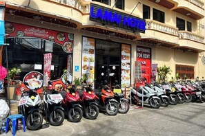 A hotel named "LAMAI HOTEL" with a restaurant named "Lomai Restaurant" and a motorbike rental sign. - Lamai Hotel (Phuket)