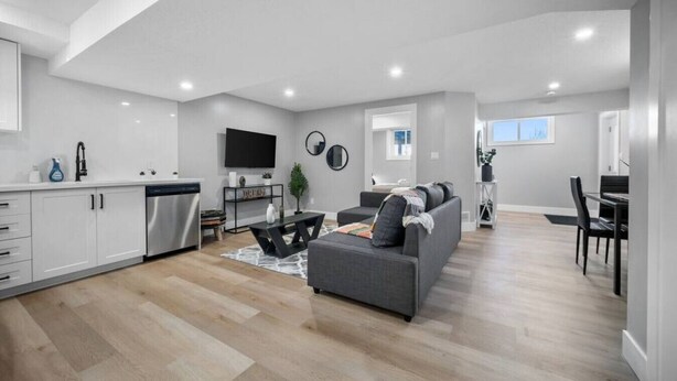 A modern apartment with a kitchen, living room, and dining area. - Bright & Cozy 1BR Basement Unit (Kitchener)