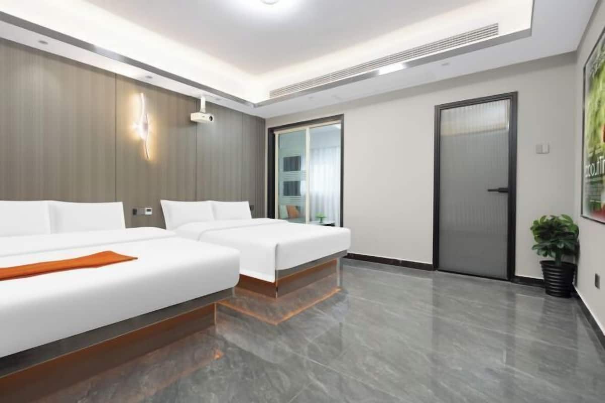 A modern hotel room with two beds, a sliding door, and a large window.