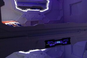 A futuristic interior with a digital display showing '05' and a hexagonal structure. - Jihe Light Luxury Art Hotel（Wuyi Square Station） (Changsha)