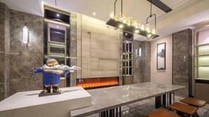 A modern interior with a marble bar, seating, and a decorative figure. - Orange Hotel (Shanghai Hongqiao Railway Station Qixin Road) (Shanghai)