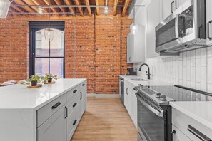 Fridge, microwave, oven, stovetop - Brick & Bed - 2B/2B Spacious Riverfront Loft (St. Louis)
