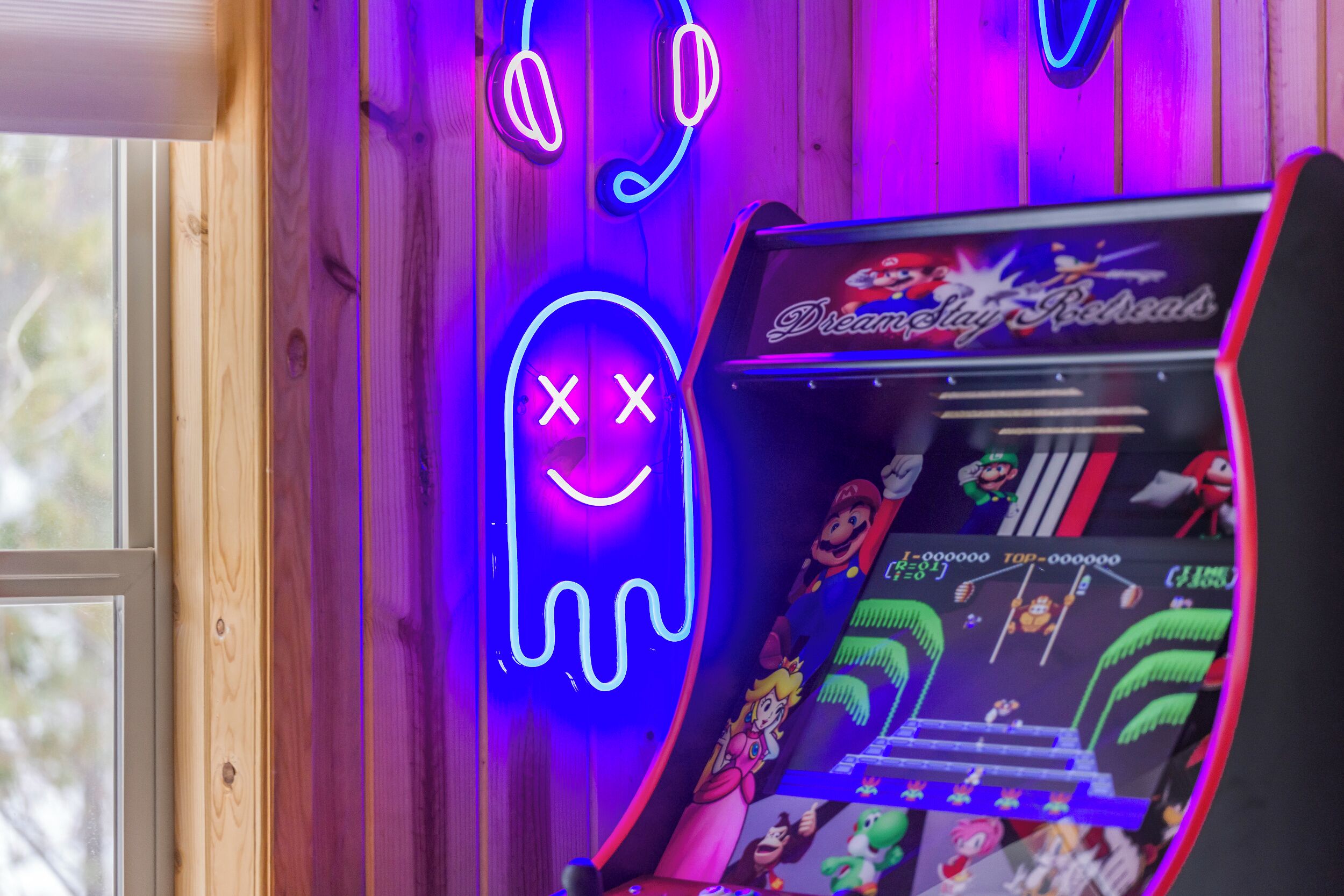 Upper level living room with arcade