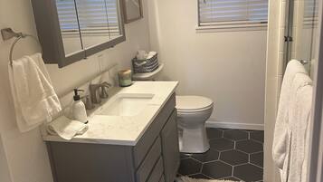 Shower, towels, soap, toilet paper