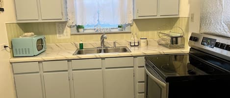 Microwave, oven, cookware/dishes/utensils