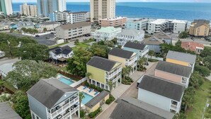 A coastal residential area with various buildings, including multi-story apartments and houses, with a view of the ocean. - Angler Villas 3 (Murrells Inlet)