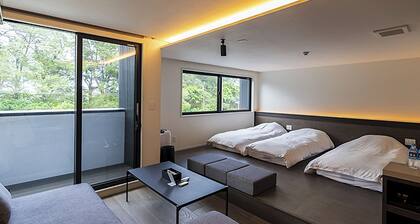 Family room modern kitchen with stove / Oshimagun Kagoshima