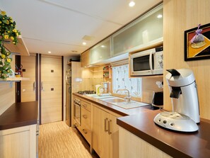 Fridge, microwave, oven, cookware/dishes/utensils - Rêves & Sérénité by Interhome (Saint Georges de la Rivière)
