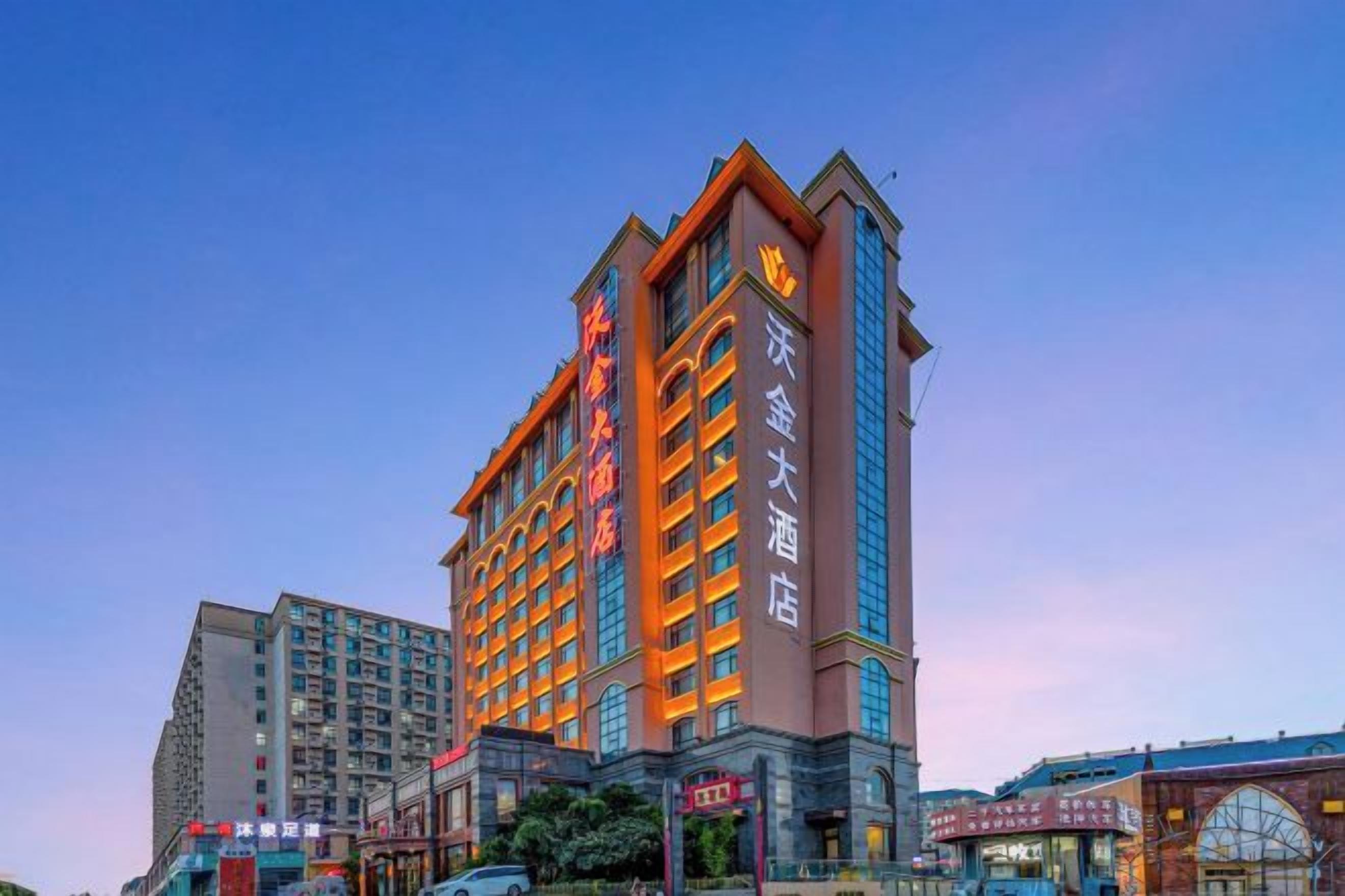 A multi-story hotel with a prominent entrance and signage.