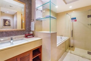 A modern bathroom with a large mirror, a sink, a glass-enclosed shower, and a towel rack. - Zhongyouyuan Hotel (Beijing Niujie Metro Station Xuanwu Hospital Branch (Beijing)