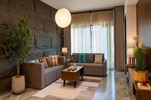 Superior Apartment, 2 Bedrooms, Kitchen, City View | Living area | 35-inch Smart TV with digital channels