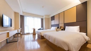 A hotel room with a large bed, a desk, a chair, a TV, and a window with curtains. - JI Hotel (Chengdu Global Center) (Chengdu)