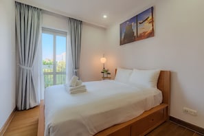 Premier Apartment, 3 Bedrooms, Kitchen, City View | Minibar, desk, laptop workspace, blackout curtains - Saigon Pavillon Suites (Ho Chi Minh City)