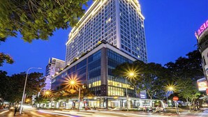 A high-rise hotel with multiple floors, large windows, and a prominent "Galaxy Office" sign. - Salute de Léman - Luxury Apartment District 3 (Ho Chi Minh City)