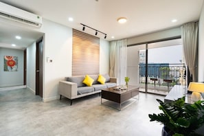 Superior Apartment, 3 Bedrooms, Kitchen, City View | Living area | 35-inch TV with cable channels - Saigon Royal - Trendy Modern Apartment (Ho Chi Minh City)