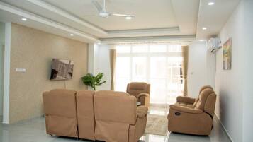 Superior Apartment, Balcony, City View | Living area | 24-inch Smart TV with digital channels