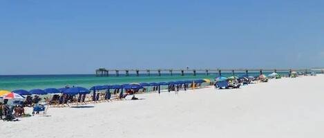 On the beach, sun-loungers, beach towels