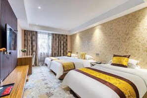 A hotel room with two beds, a wooden bench, a TV, and a patterned carpet. - Geyue Zhenpin Hotel (Hangzhou)